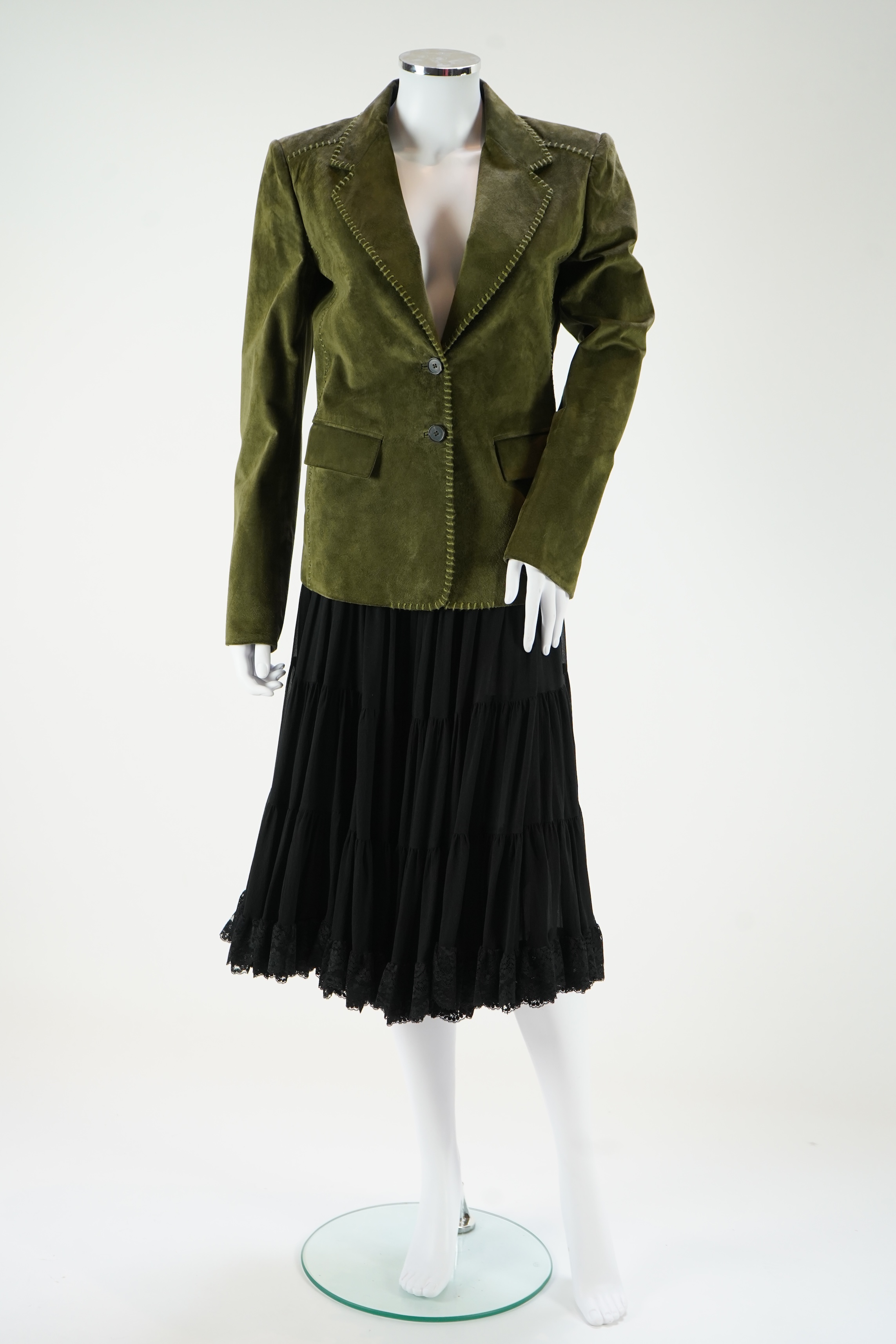 A lady's Yves Saint Laurent olive green suede jacket with stitching details and a black YSL (label missing) gypsy skirt with underskirt. IT 38 (UK size 10)